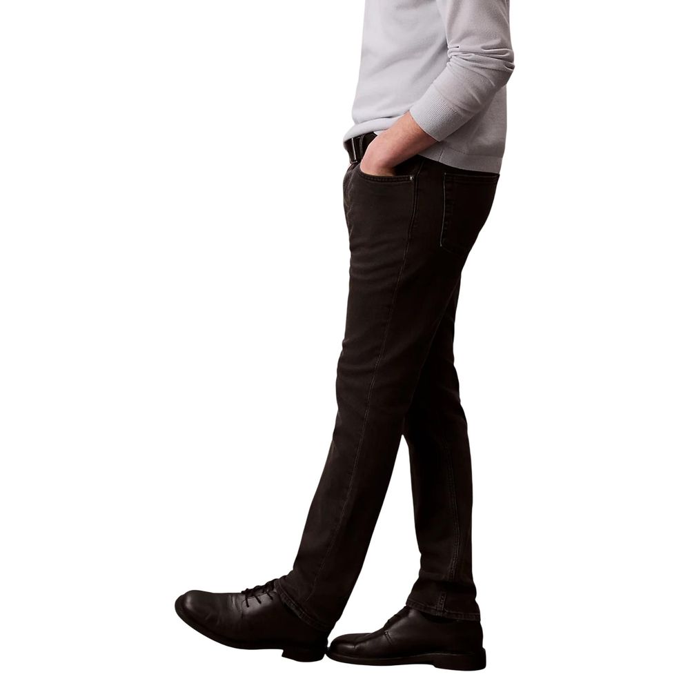 Jeans by Calvin Klein Jeans for men in stretch denim cotton black features a polished silhouette with a polished skinny & slim, reaching a polished long and finished with a polished .
