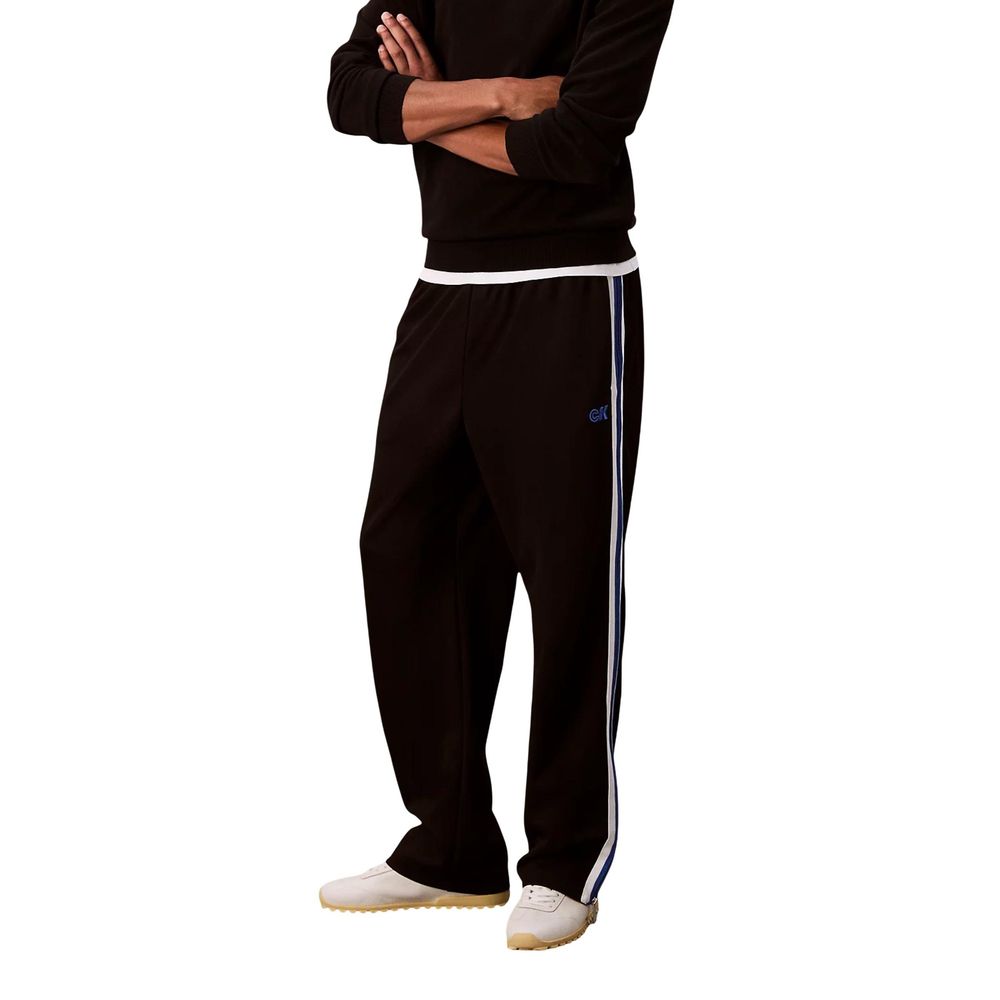 Activewear Jogger Pants by Calvin Klein Jeans for men in stretch polyester twill black & striped features a contemporary silhouette with , a contemporary straight-leg, long hem, and for a premium, high-performance aesthetic.