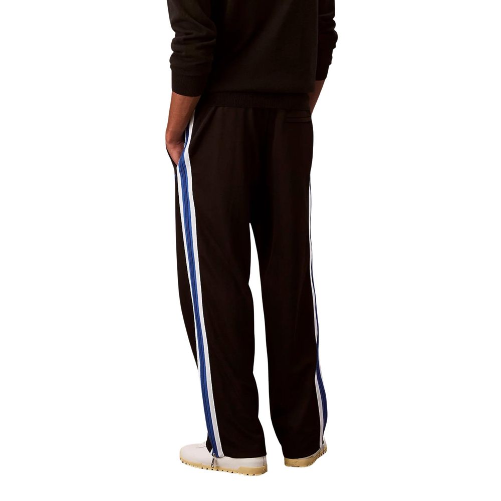 Activewear Jogger Pants by Calvin Klein Jeans for men in stretch polyester twill black & striped features an dynamic straight-leg with long, , and functional for an dynamic silhouette.