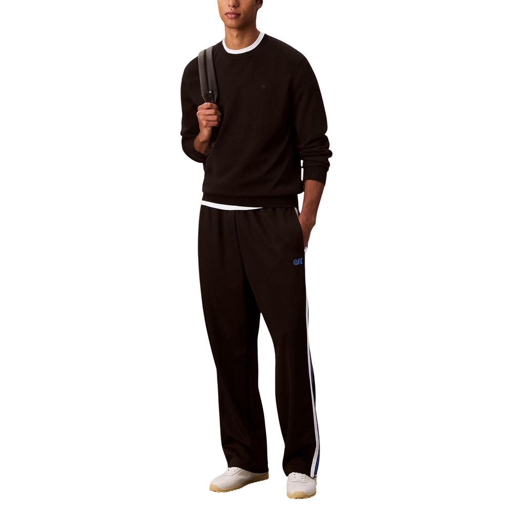 Activewear Jogger Pants by Calvin Klein Jeans for men in stretch polyester twill black & striped features a contemporary silhouette with , a contemporary straight-leg, long hem, and for a premium, high-performance aesthetic.