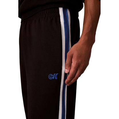 Activewear Jogger Pants by Calvin Klein Jeans for men in stretch polyester twill black & striped features a versatile silhouette, integrating performance with a versatile straight-leg, long, and comfortable .