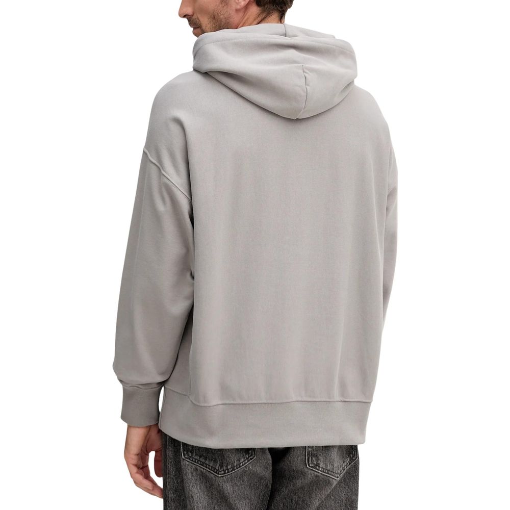 Hooded Hoodie by Calvin Klein Jeans for men in cotton terrycloth & polyester gray features a edgy silhouette, detailed with a edgy hooded neckline and for a refined finish.