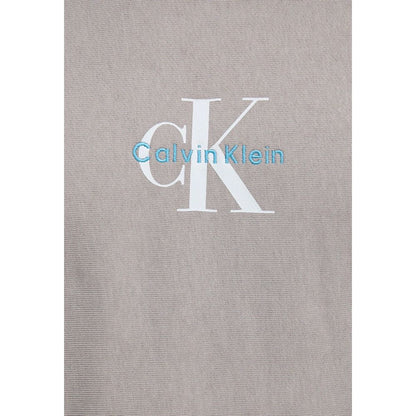 Hooded Hoodie by Calvin Klein Jeans for men in cotton terrycloth & polyester gray features an dramatic silhouette, showcasing a sophisticated and dramatic for a refined, modern aesthetic.