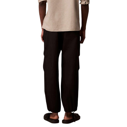 Activewear Jogger Pants by Calvin Klein Jeans for men in nylon cotton black features an dynamic with long, , and functional breathable-design for an dynamic silhouette.