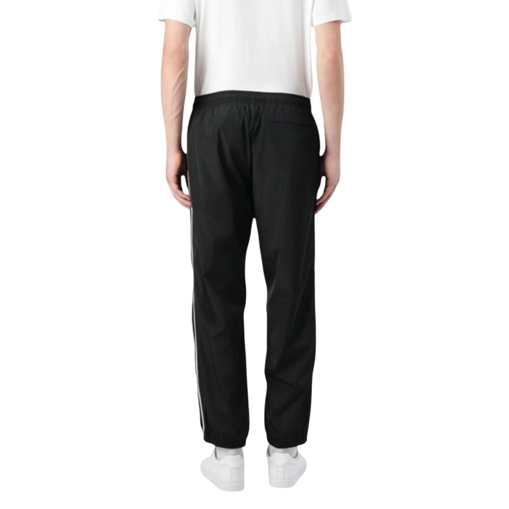 Activewear Jogger Pants by Calvin Klein Jeans for men in poly nylon fabric black features an sporty regular-fit with a and long, showcasing sporty .