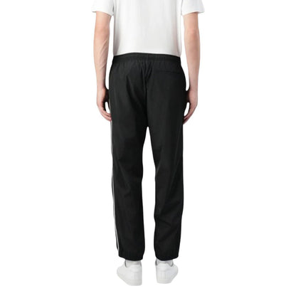 Activewear Jogger Pants by Calvin Klein Jeans for men in poly nylon fabric black features an sporty regular-fit with a and long, showcasing sporty .