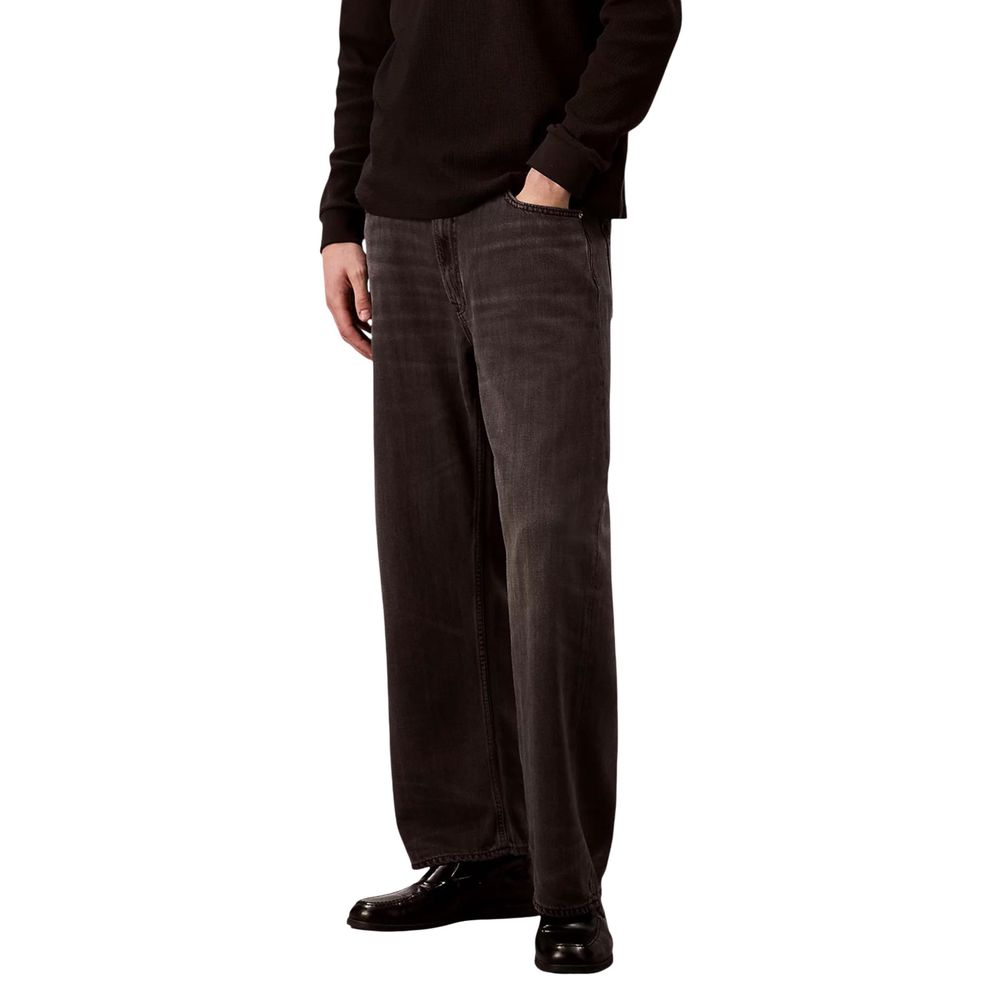 Jeans by Calvin Klein Jeans for men in viscose & denim black features a polished silhouette with a polished relaxed-fit, regular-fit & wide, reaching a polished long and finished with a polished .