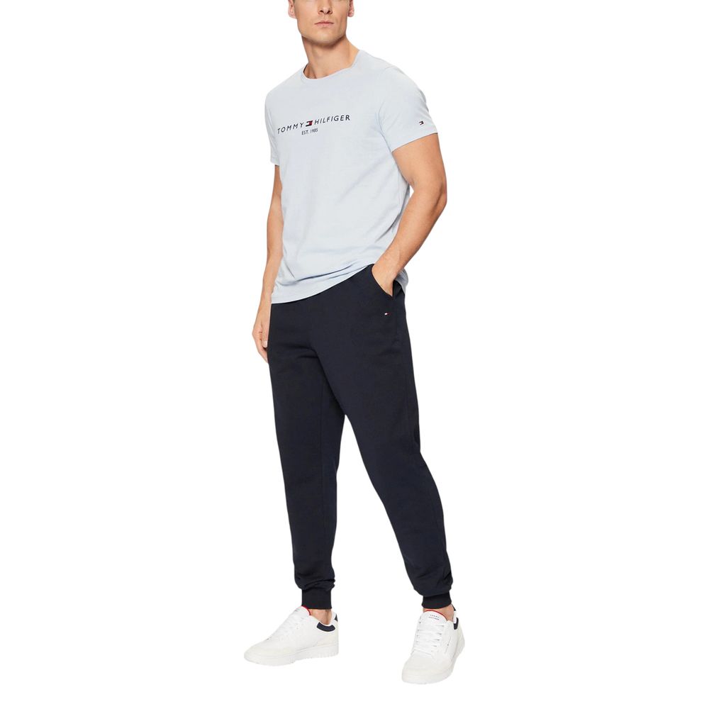Activewear Jogger Pants by Tommy Hilfiger for men in cotton terrycloth blue & natural features an sporty regular-fit with a and long, showcasing sporty .