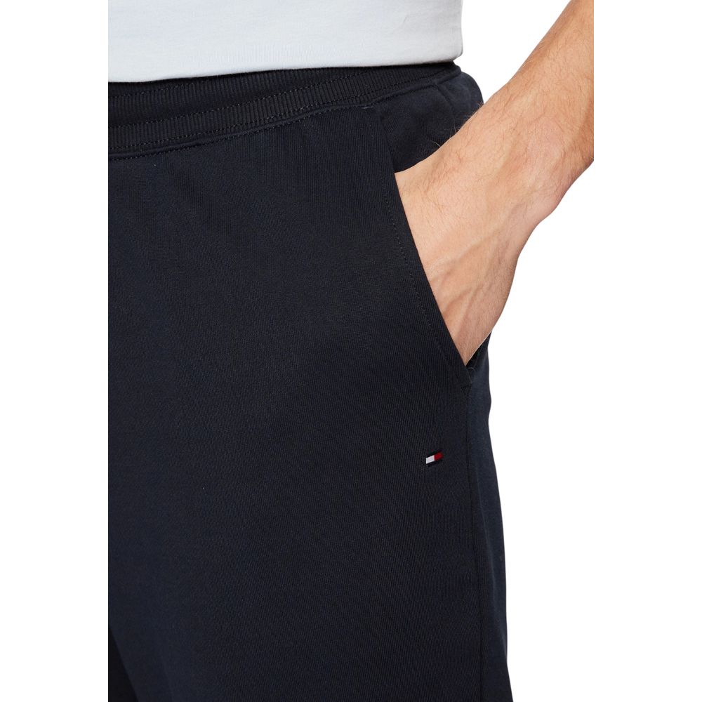Activewear Jogger Pants by Tommy Hilfiger for men in cotton terrycloth blue & natural features a contemporary silhouette with , a contemporary regular-fit, long hem, and for a premium, high-performance aesthetic.