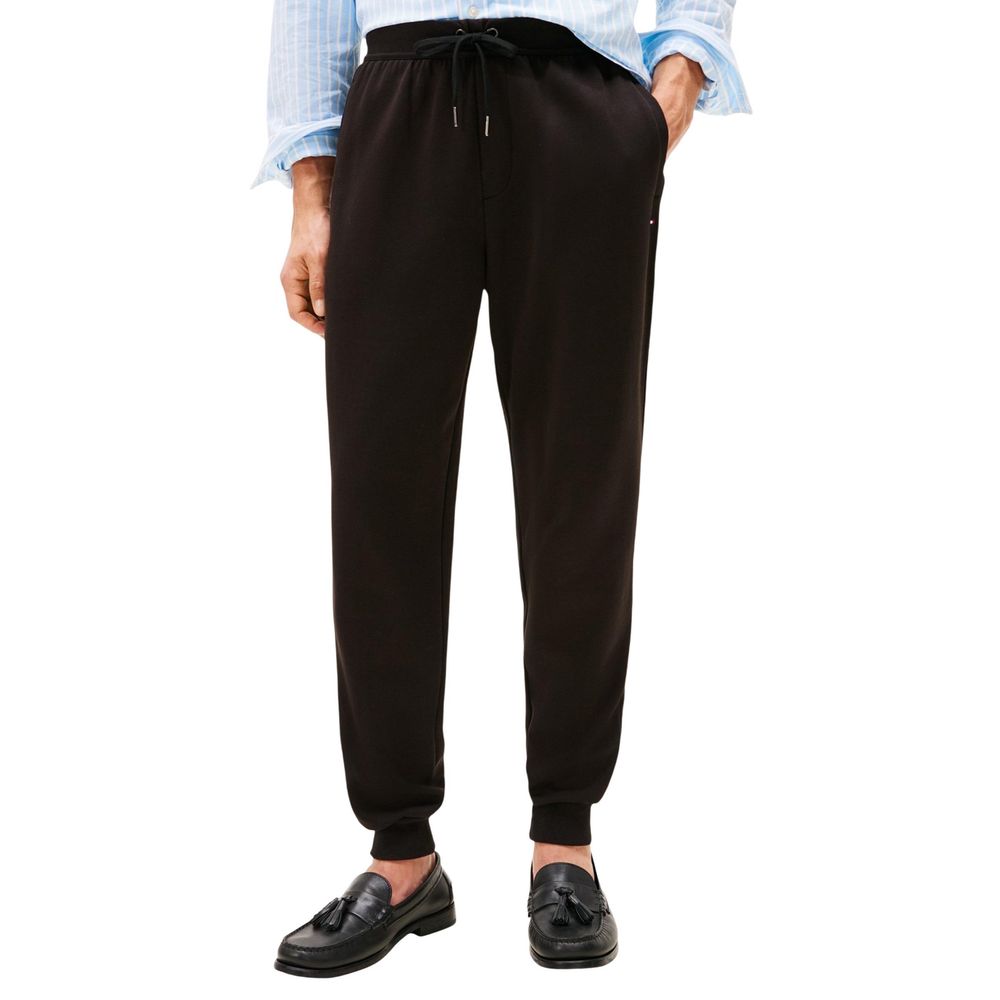 Activewear Jogger Pants by Tommy Hilfiger for men in cotton polyester black features a versatile silhouette, integrating performance with a versatile regular-fit, long, and comfortable .