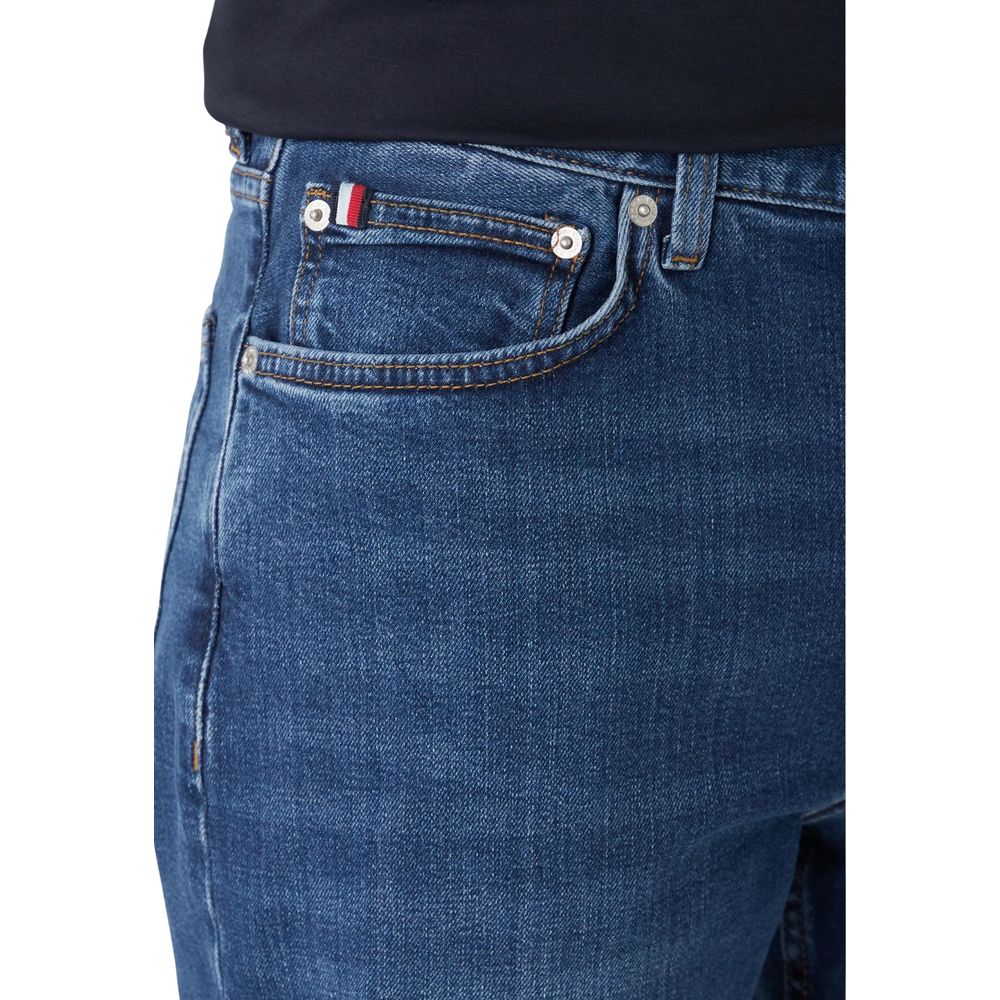 Jeans by Tommy Hilfiger for men in stretch denim cotton blue features a refined silhouette with a refined straight-leg, relaxed-fit & regular-fit, defined by a and a refined long for a refined finish.