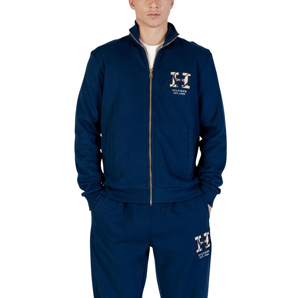 Activewear Sweatshirt by Tommy Hilfiger for men in cotton polyester blue showcases a athletic silhouette with sleeves, a athletic hooded high-collar neckline, and high-performance for a athletic aesthetic.