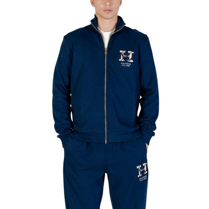 Activewear Sweatshirt by Tommy Hilfiger for men in cotton polyester blue showcases a athletic silhouette with sleeves, a athletic hooded high-collar neckline, and high-performance for a athletic aesthetic.