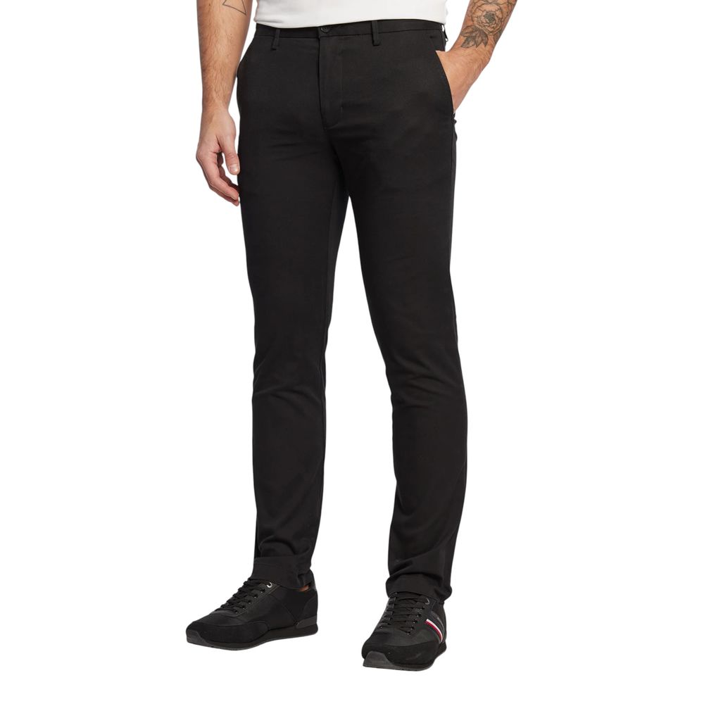 Trousers by Tommy Hilfiger for men in stretch cotton black features an sartorial silhouette, showcasing a precise skinny & slim and long with a sartorial for a refined look.