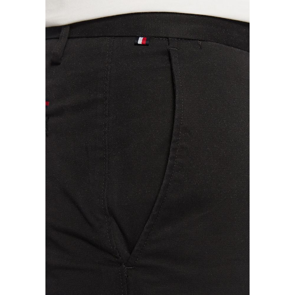 Trousers by Tommy Hilfiger for men in stretch cotton black presents a smart silhouette, meticulously detailed with a smart skinny & slim, a smart long, and a smart .