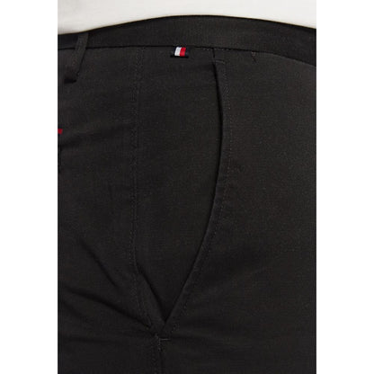 Trousers by Tommy Hilfiger for men in stretch cotton black presents a smart silhouette, meticulously detailed with a smart skinny & slim, a smart long, and a smart .