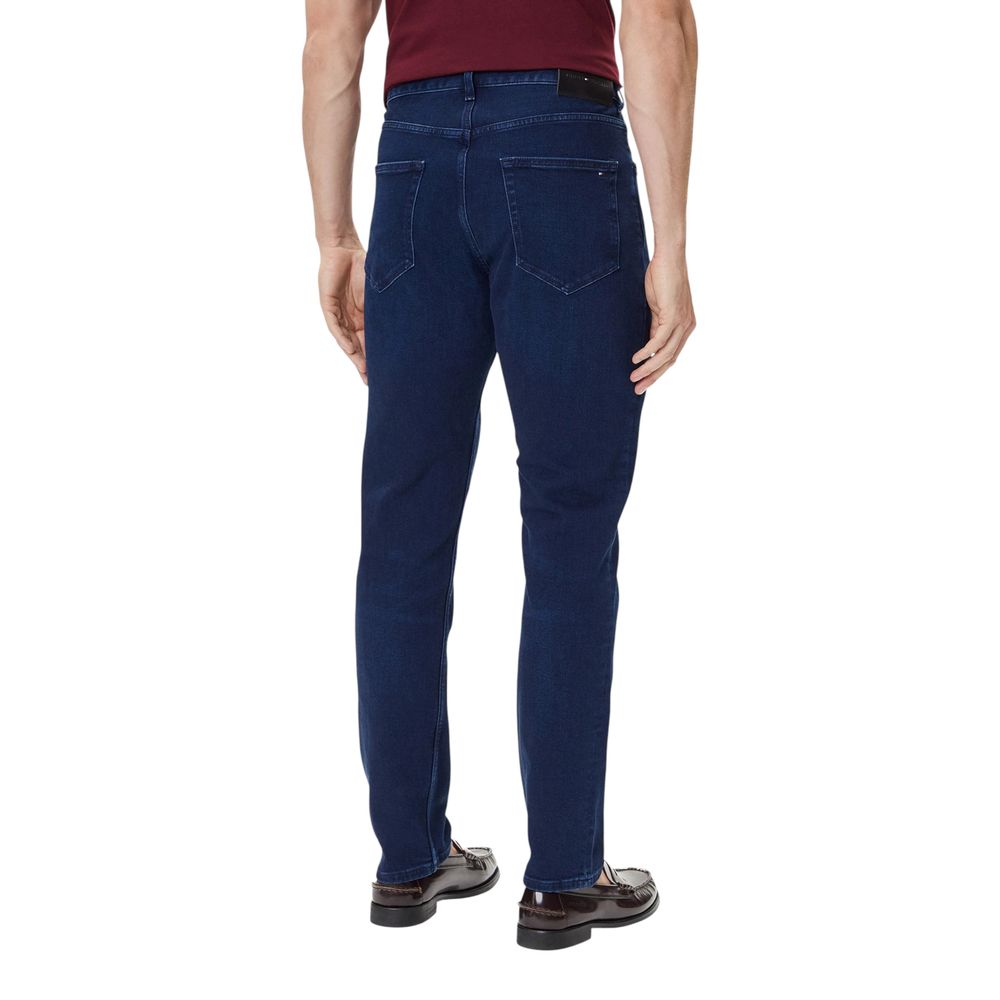 Jeans by Tommy Hilfiger for men in stretch denim cotton blue features a polished silhouette with a polished straight-leg, relaxed-fit & regular-fit, reaching a polished long and finished with a polished .