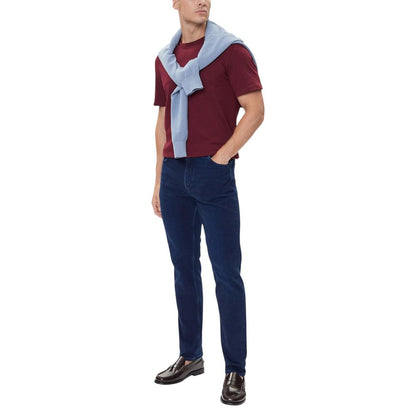 Jeans by Tommy Hilfiger for men in stretch denim cotton blue presents a tailored silhouette, showcasing a tailored straight-leg, relaxed-fit & regular-fit and long cut with a refined for a truly tailored aesthetic.