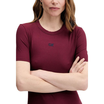 Dress by Calvin Klein Jeans for women in stretch lycra & modal bordeaux showcases a striking silhouette, elegantly detailed with a , refined round neckline, and a striking short long for a striking finish.
