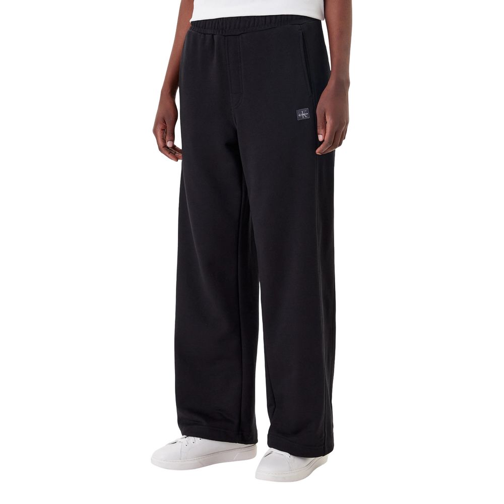 Activewear Jogger Pants by Calvin Klein Jeans for women in cotton terrycloth black features an kinetic relaxed-fit & wide and long with a , showcasing high-performance for an kinetic look.