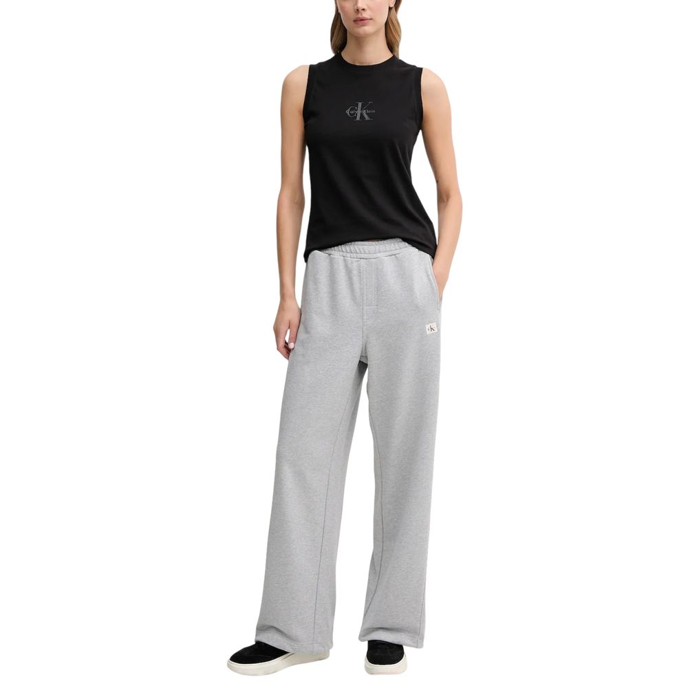 Activewear Jogger Pants by Calvin Klein Jeans for women in cotton terrycloth gray features a contemporary silhouette with , a contemporary relaxed-fit & wide, long hem, and for a premium, high-performance aesthetic.