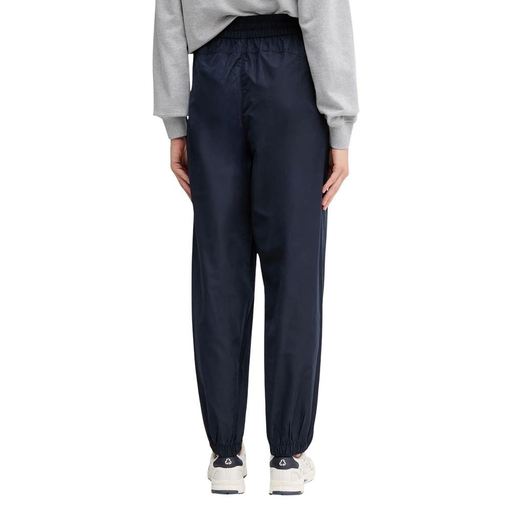 Activewear Jogger Pants by Calvin Klein Jeans for women in polyester blue features a contemporary silhouette with , a contemporary relaxed-fit, long hem, and for a premium, high-performance aesthetic.