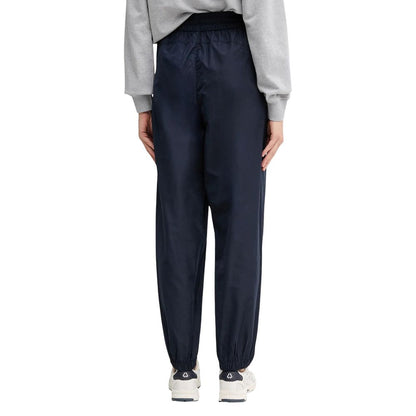 Activewear Jogger Pants by Calvin Klein Jeans for women in polyester blue features a contemporary silhouette with , a contemporary relaxed-fit, long hem, and for a premium, high-performance aesthetic.
