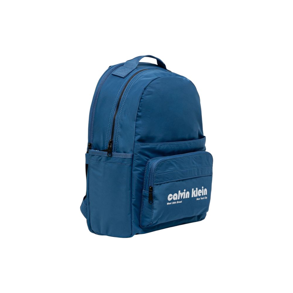 Compact Backpack by Calvin Klein for men in polyester blue, signature & print showcases an architectural Polyester Compact Backpack design, featuring a secure zipper, ample external-pockets & laptop-compartment, and architectural handle, backpack-strap & adjustable-strap for a sophisticated look.