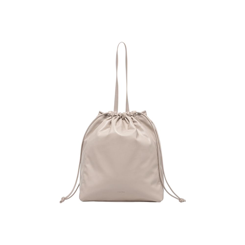Large Tote Handbag by Calvin Klein for women in polyethylene & polyurethane beige features a signature silhouette, showcasing a secure drawstring and signature with versatile handle for a sophisticated look.