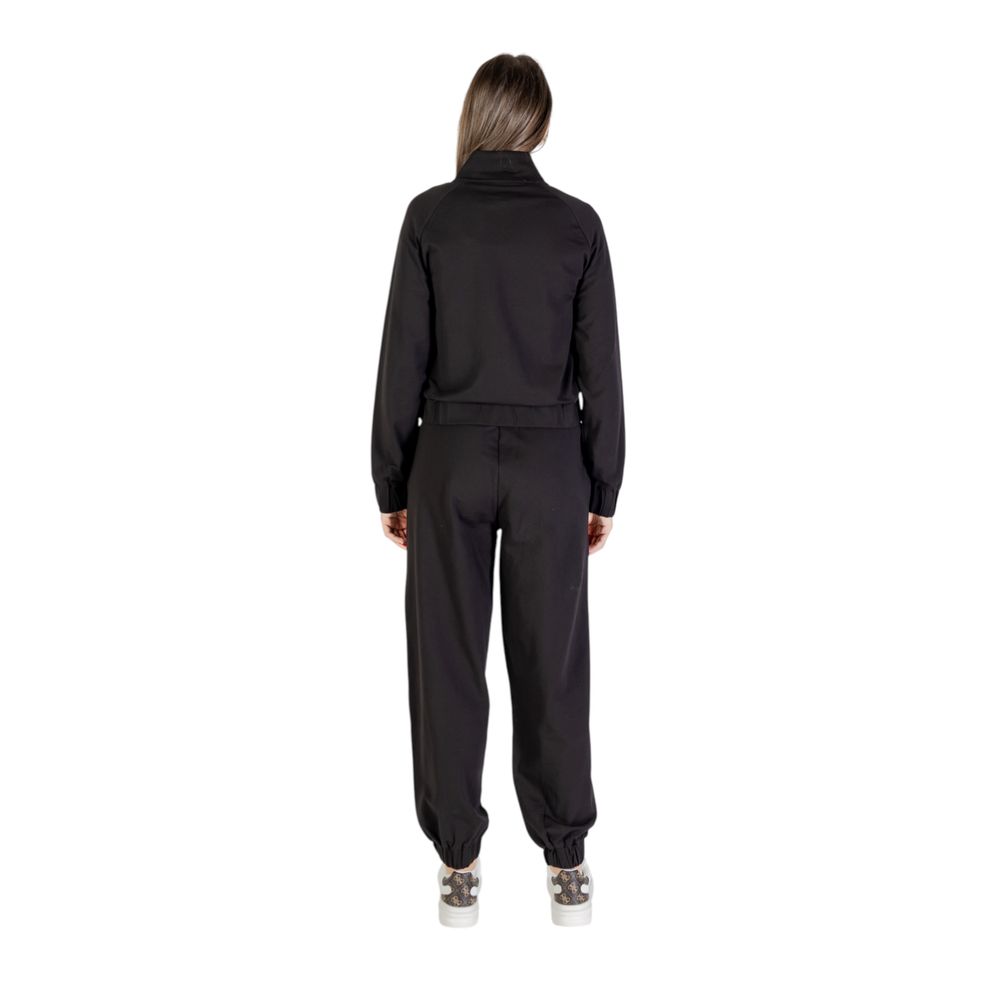 This Track Jacket by EA7 Emporio Armani for women in stretch cotton black presents a contemporary silhouette, showcasing with and a contemporary high-collar neckline.