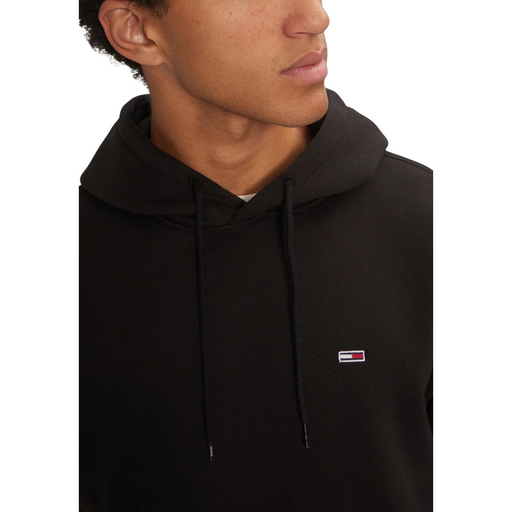 Hooded Hoodie by Tommy Hilfiger Jeans for men in cotton & kangaroo black features a slouchy chic silhouette, detailed with a slouchy chic and a signature hooded neckline for an elevated aesthetic.