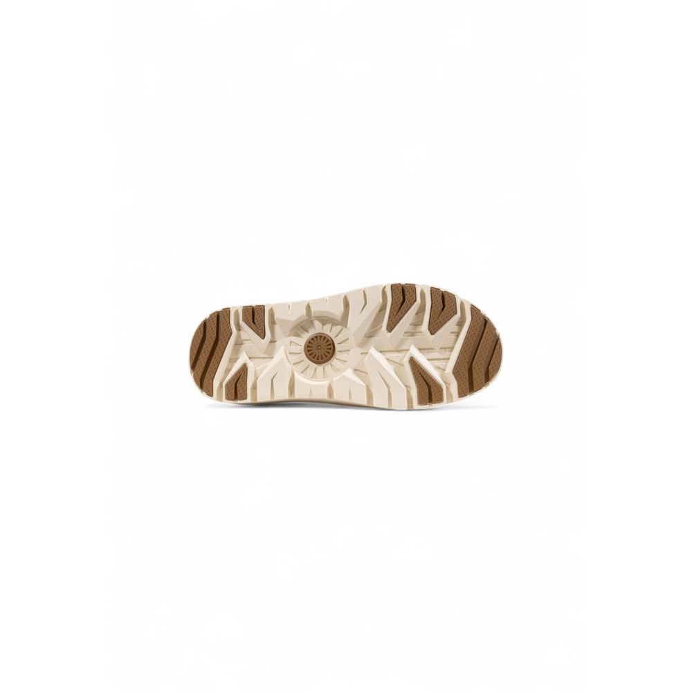 Clogs Flat Shoes by UGG for men in suede leather beige presents a stalwart silhouette as Men's Padded Suede Leather Clogs Flat Shoes, artfully designed with a and a stalwart for a refined, upscale finish.