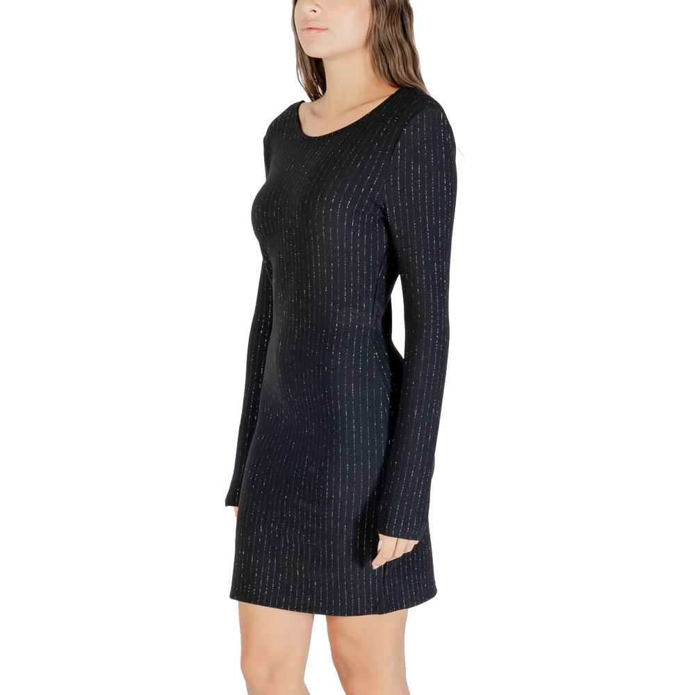 Dress by Jacqueline De Yong for women in stretch polyester & lurex black & striped features a dramatic silhouette, showcasing an elegant and that flows into a dramatic short.