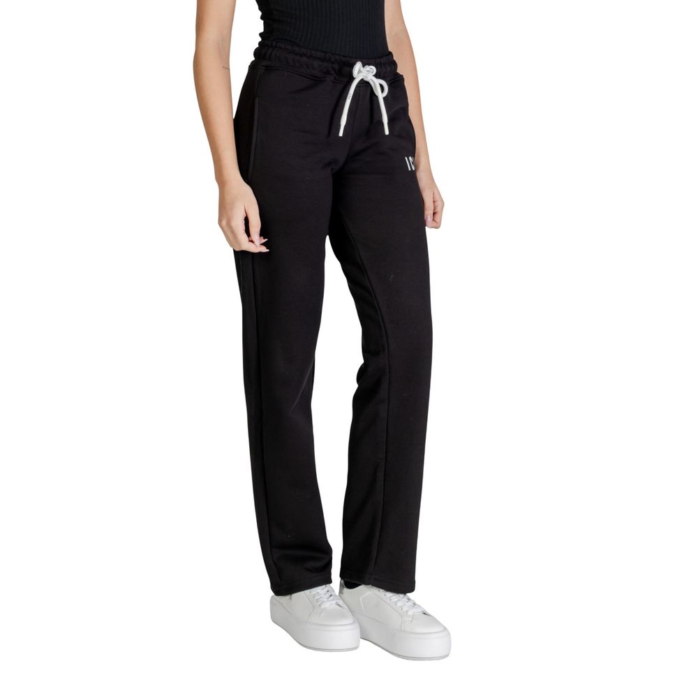 Activewear Jogger Pants by Icon for women in cotton polyester black features a contemporary silhouette with , a contemporary regular-fit, long hem, and for a premium, high-performance aesthetic.