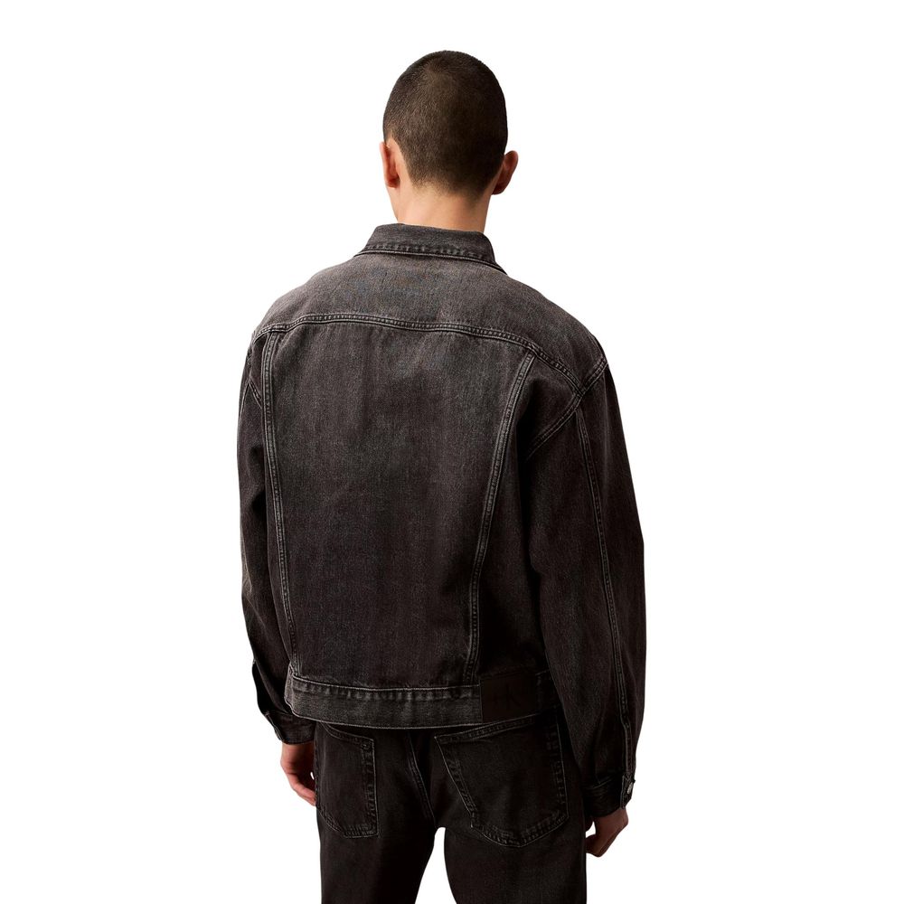 Jacket by Calvin Klein Jeans for men in denim cotton black showcases a contemporary silhouette, detailed with a contemporary shirt-collar neckline and premium pockets for a sophisticated finish.