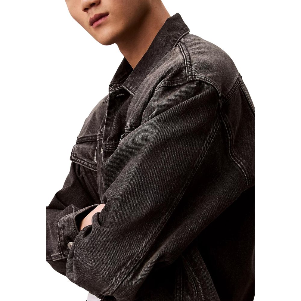 Jacket by Calvin Klein Jeans for men in denim cotton black features an utilitarian silhouette with a refined shirt-collar neckline, showcasing sophisticated pockets for an utilitarian aesthetic.