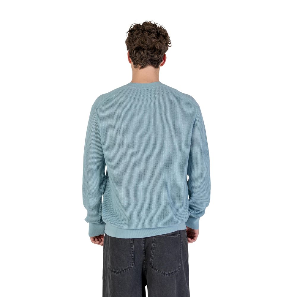 Sweatshirt by Calvin Klein Jeans for men in cotton & polyester blue features an provocated silhouette, detailed with a provocated and a refined crew neckline for a sophisticated aesthetic.