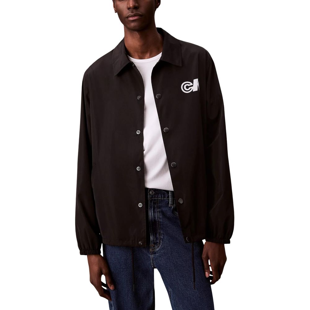 Windbreaker Jacket by Calvin Klein Jeans for men in nylon & polyester black features an perennial silhouette with a refined and perennial windproof for a sophisticated weather-resistant look.