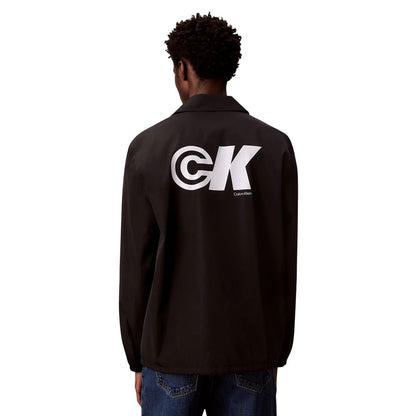 Windbreaker Jacket by Calvin Klein Jeans for men in nylon & polyester black features an enduring silhouette, showcasing technical windproof and a sophisticated for a truly enduring aesthetic.