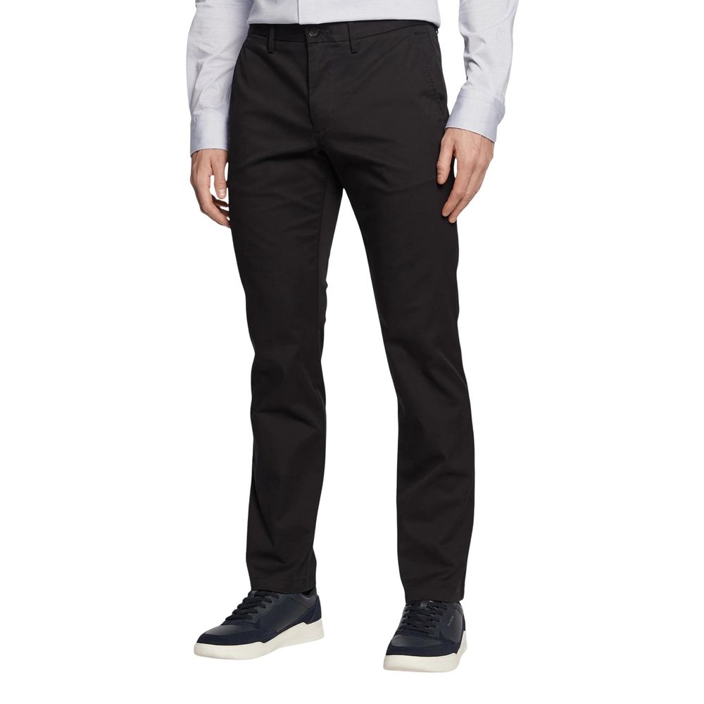 Trousers by Tommy Hilfiger for men in stretch cotton black features a sculptural silhouette, showcasing a sculptural regular-fit and long with a sophisticated for a sculptural finish.