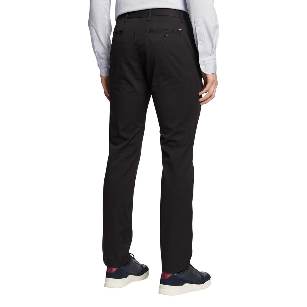 Trousers by Tommy Hilfiger for men in stretch cotton black presents a smart silhouette, meticulously detailed with a smart regular-fit, a smart long, and a smart .