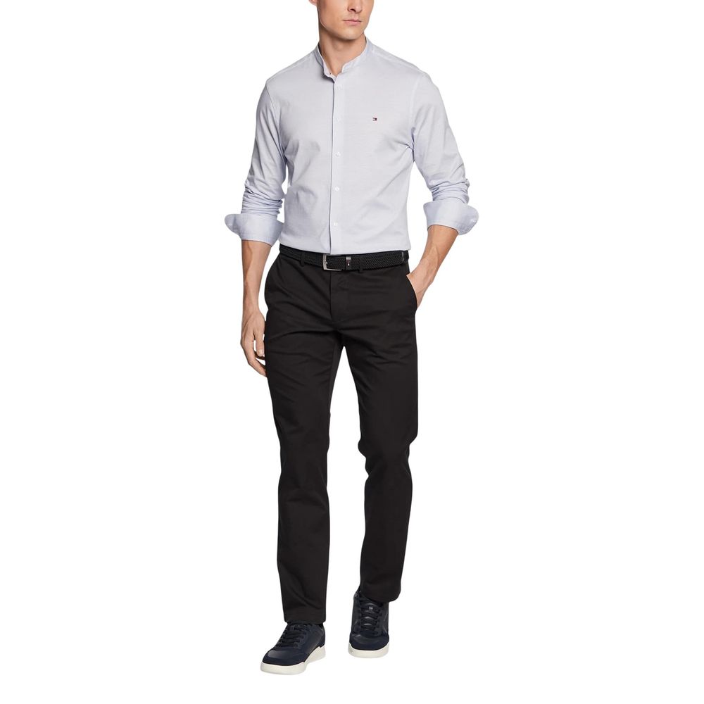 Trousers by Tommy Hilfiger for men in stretch cotton black features an sartorial silhouette, showcasing a precise regular-fit and long with a sartorial for a refined look.