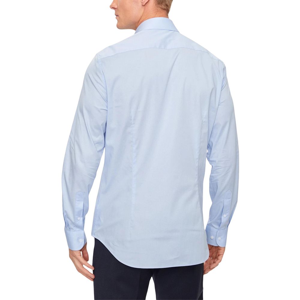 Shirt by Tommy Hilfiger for men in stretch organic cotton blue, featuring a nuanced and nuanced for a sophisticated finish.