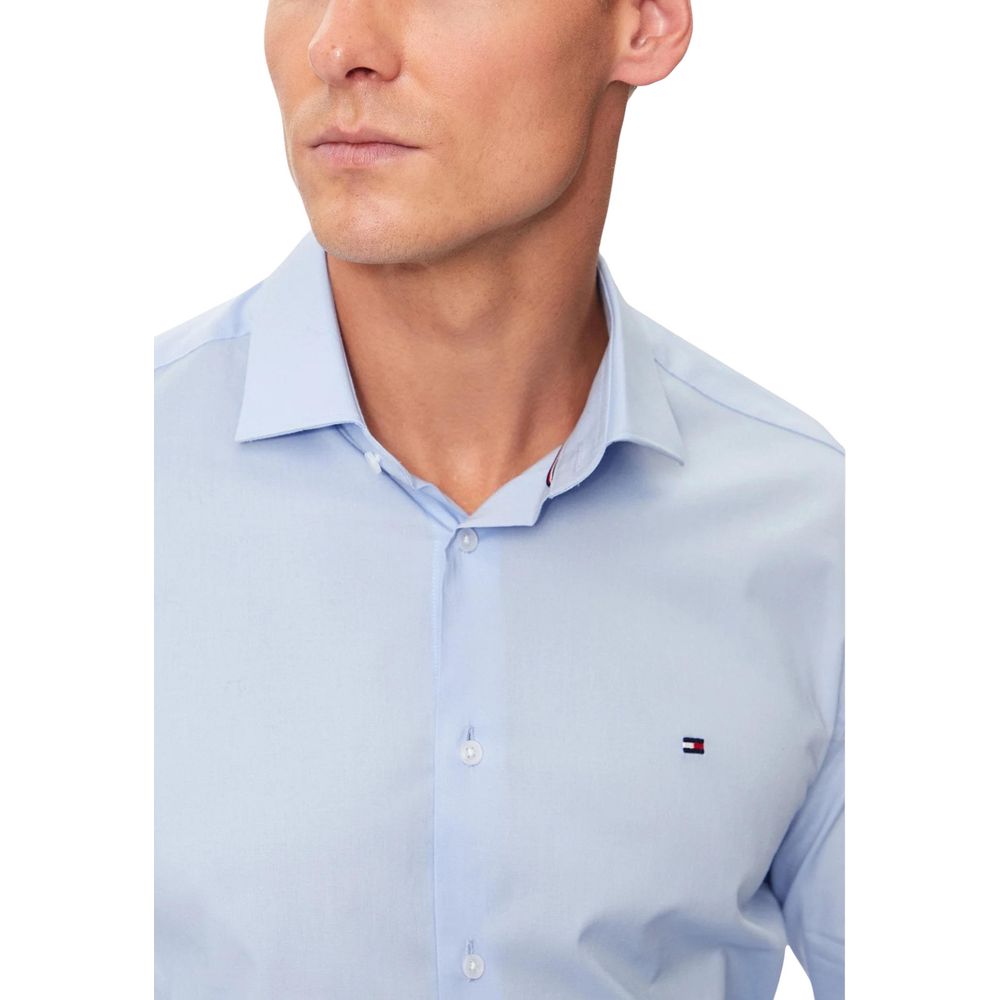 Shirt by Tommy Hilfiger for men in stretch organic cotton blue, featuring a nuanced and nuanced for a sophisticated finish.