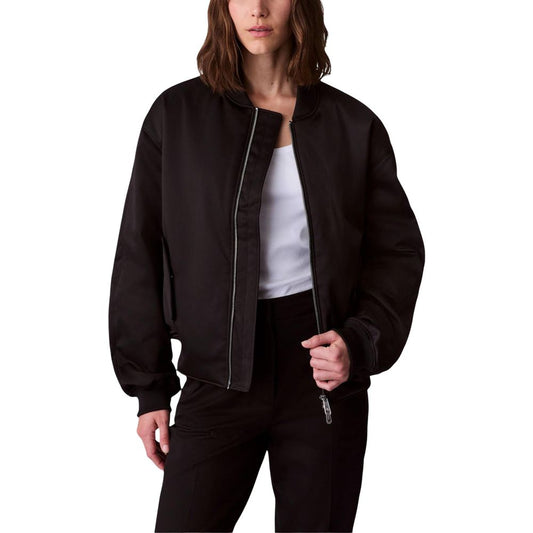 This Bomber Jacket by Calvin Klein Jeans for women in polyester satin black exhibits a edgy silhouette, meticulously detailed with functional and a edgy for a edgy finish.