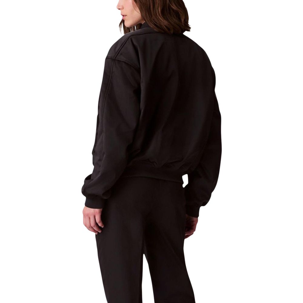 Bomber Jacket by Calvin Klein Jeans for women in polyester satin black presents a effortlessly chic silhouette, showcasing a sophisticated and premium for a truly effortlessly chic finish.