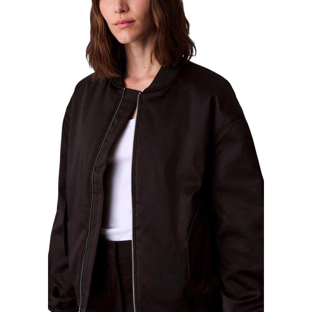 Bomber Jacket by Calvin Klein Jeans for women in polyester satin black features a city-ready silhouette, detailed with and a city-ready .