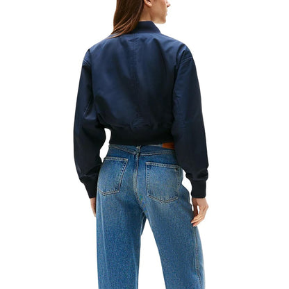 Bomber Jacket by Tommy Hilfiger for women in polyester blue showcases a bohemian silhouette, artfully detailed with a bohemian and signature for a truly bohemian finish.