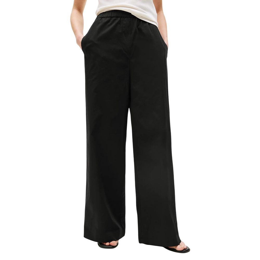 Trousers by Tommy Hilfiger for women in organic cotton black features a tailored silhouette with a tailored flared, bootcut, relaxed-fit & wide, defined by its long and a sophisticated .
