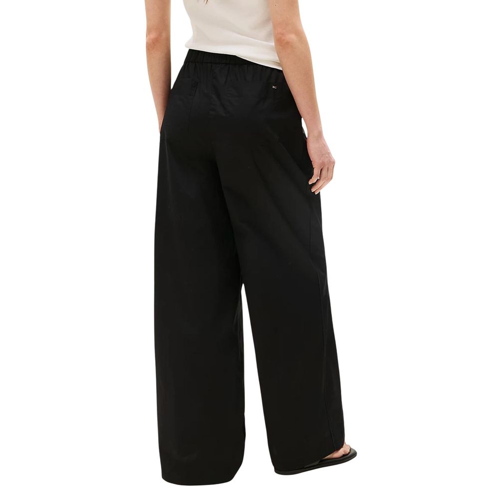 Trousers by Tommy Hilfiger for women in organic cotton black presents a smart silhouette, meticulously detailed with a smart flared, bootcut, relaxed-fit & wide, a smart long, and a smart .